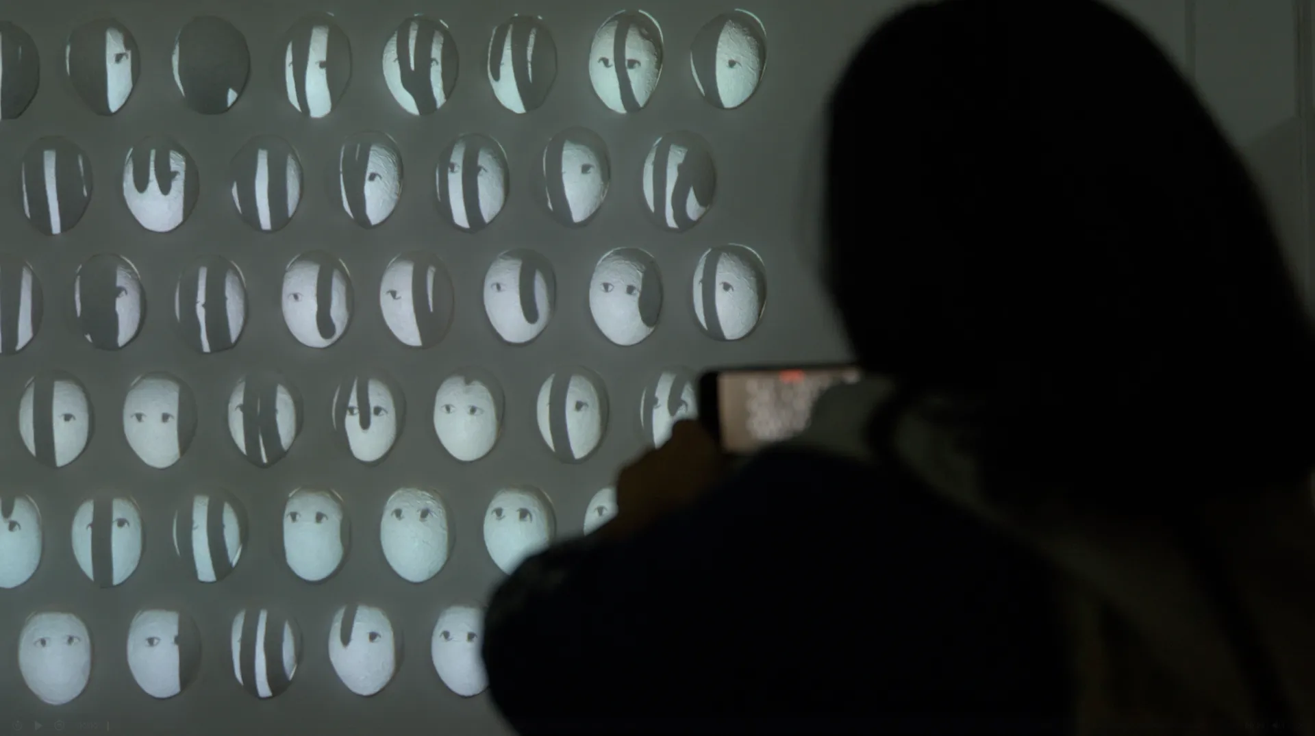 Visitor Documenting Projected Ink Drops